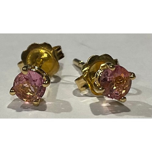 808 - A pair of gold coloured metal ear studs set with brilliant cut pink stones, stamped '750' for 18ct g... 