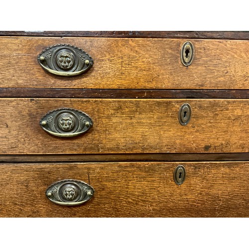 36 - A George III oak bureau, fall door to top enclosing an interior fitted with central small cupboard a... 