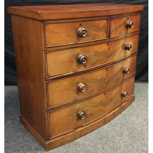 85 - A Victorian mahogany bow-front chest of drawers, having a pair of short, above three graduated long ... 