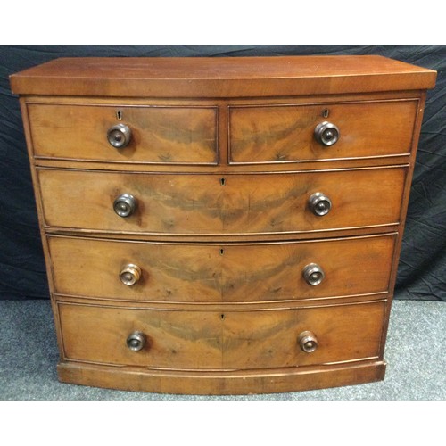 85 - A Victorian mahogany bow-front chest of drawers, having a pair of short, above three graduated long ... 