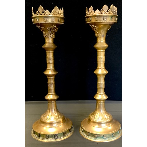 100 - A pair of 17th century style brass pricket candlesticks, (lacking point),  49cm high, 18cm diameter ... 