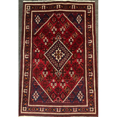 102 - A North west Persian Josheghan rug / carpet, central diamond-shaped medallion within a field of styl... 