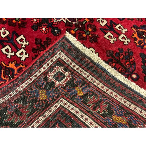 102 - A North west Persian Josheghan rug / carpet, central diamond-shaped medallion within a field of styl... 