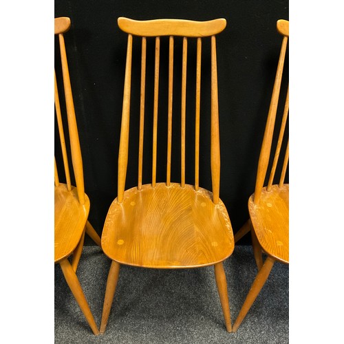 113 - A set of four Lucien Ercolani, for Ercol, ‘Goldsmith’ chairs, model 369, beech wood spindle-backs, a... 