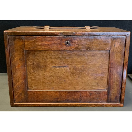 114 - A Peckhams's oak Engineers/Watch makers tool box containing a large quantity of assorted watch spare... 