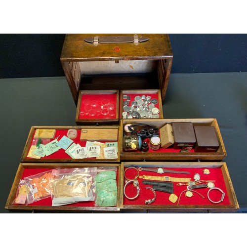 114 - A Peckhams's oak Engineers/Watch makers tool box containing a large quantity of assorted watch spare... 