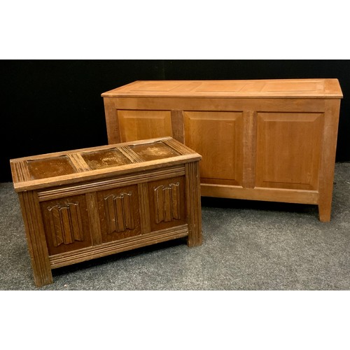 131 - Two Late 20th century oak blanket panel chests; 66cm high x 123cm width x 52cm depth, 45cm high x 79... 