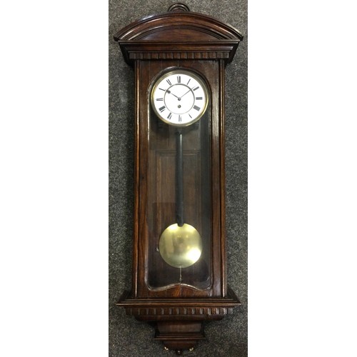 142 - An oak cased Vienna wall clock, single weight Viennese movement, white enamelled dial with black Rom... 