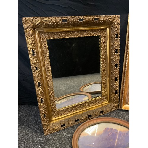 144 - An early 20th century gilt framed wall mirror, ornate gilt frame, bevelled plate 50cm x 40cm;  a pai... 