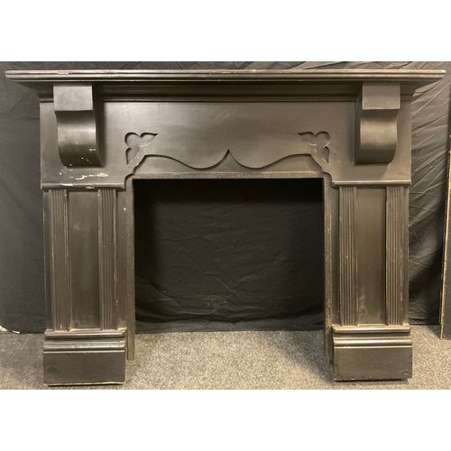 147 - Architectural salvage - a large ebonised effect fire-surround chimney piece, 123cm high x 161cm wide... 