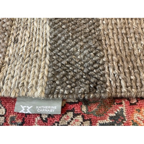 166 - A Catherine Carnaby hand made Varied Stripe Coast pattern wool rug, approx. 160cm x 230cm