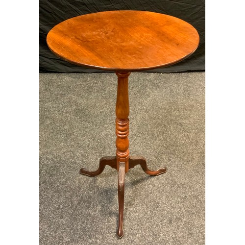 179 - An early 20th century mahogany tall tilt-top table, circular top, turned column, carved tripod feet,... 