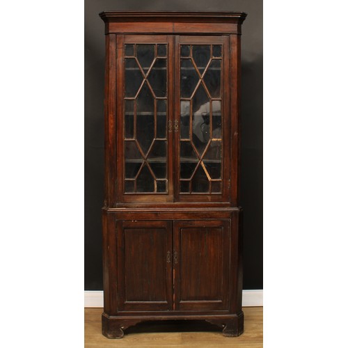 484 - An oak floor standing corner display cabinet, 197.5cm high, 89cm wide, 46cm deep.