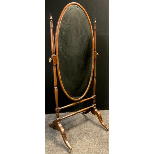 491 - A reproduction mahogany cheval mirror, oval mirror, turned supports and stretchers, 166.5cm high x 7... 