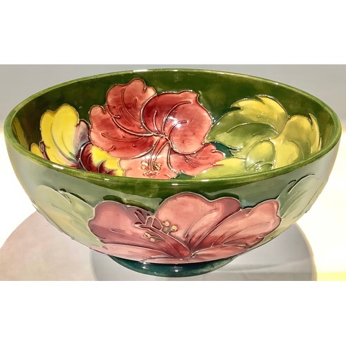 6 - A Moorcroft Hibiscus pattern bowl, tube lined with flowers on a green ground, 20cm diameter, Queen M... 