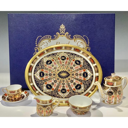 9 - A Royal Crown Derby 1128 pattern Imari palette miniature tea service on tray, comprising, teapot, mi... 