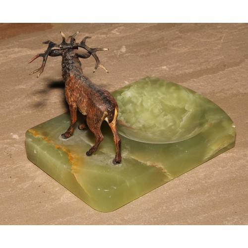 35 - An Austrian cold painted bronze, of a stag, mounted on a green onyx dish, 14cm long, c.1930