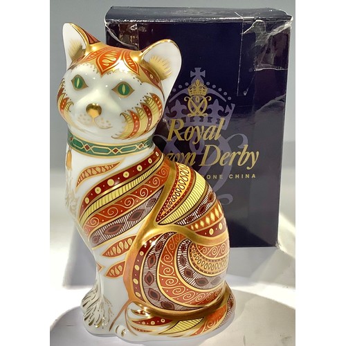 44 - A Royal Crown Derby paperweight, Marmaduke the cat, 13cm high, specially commissioned by The Guild o... 