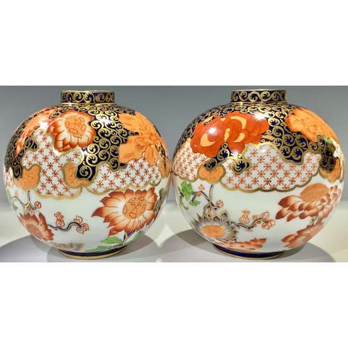 46 - A pair of Derby Crown Porcelain Company globular vases, decorated in the Imari palette, pattern numb... 