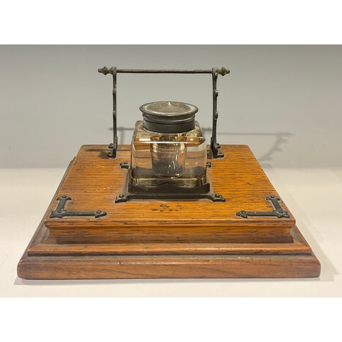 61 - A late Victorian oak inkstand, c.1890