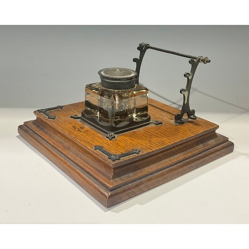 61 - A late Victorian oak inkstand, c.1890