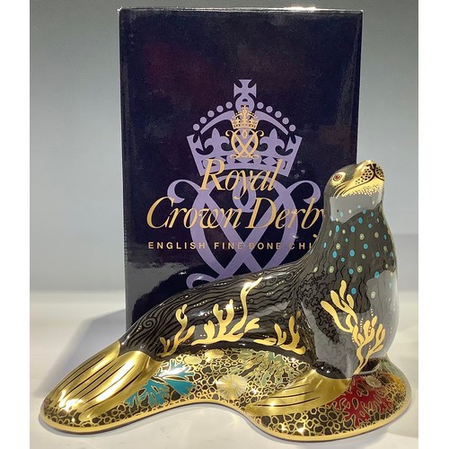 133 - A Royal Crown Derby paperweight, Sea Lion, gold stopper, 15cm long, boxed