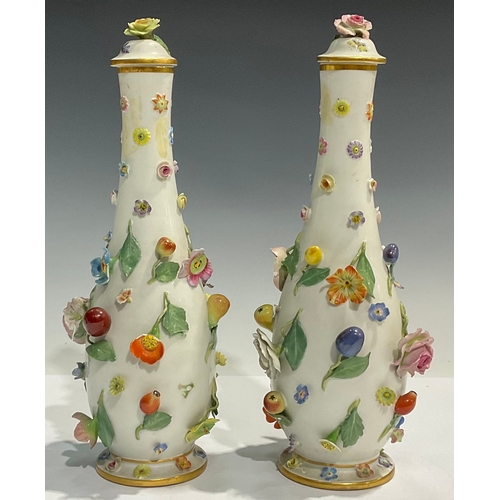 139 - A pair of Meissen elongated ovoid vases and covers, each encrusted with flowers and fruit, flower fi... 