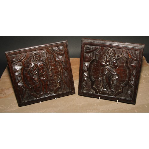 154 - A pair of North European oak panels, carved with figures emblematic of the Autumn and Winter, 19cm x... 