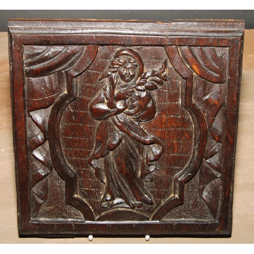 154 - A pair of North European oak panels, carved with figures emblematic of the Autumn and Winter, 19cm x... 