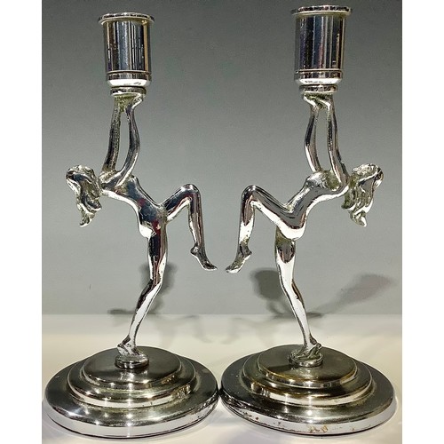 162 - A pair of Art Deco chrome figural candlesticks, each as a female nude dancer, 18.5cm high