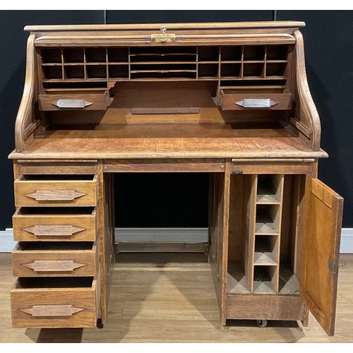 113 - An Art Deco period oak tambour roll top desk, 126cm high, 125cm wide, 76.5cm deep, c.1925