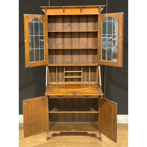 115 - An Arts & Crafts oak bureau bookcase, 181cm high, 87cm wide, 32cm deep, c.1910