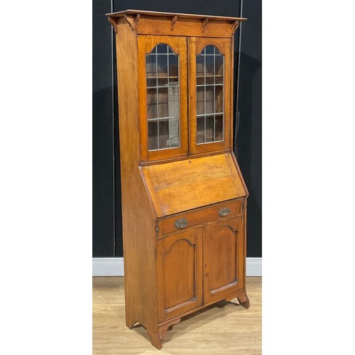 115 - An Arts & Crafts oak bureau bookcase, 181cm high, 87cm wide, 32cm deep, c.1910