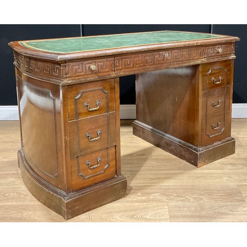 116 - A George III Revival mahogany desk, discorectangular top with inset tooled and gilt writing surface ... 