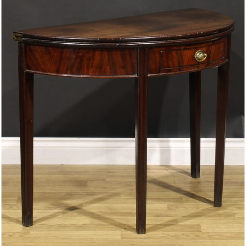 212 - A George III mahogany demilune tea table, hinged top above a single frieze drawer, tapered legs, 73c... 