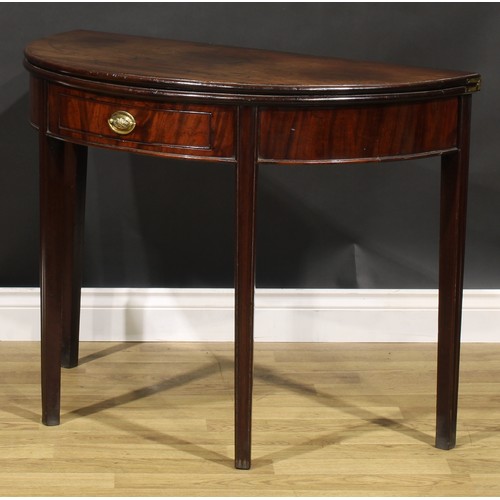 212 - A George III mahogany demilune tea table, hinged top above a single frieze drawer, tapered legs, 73c... 