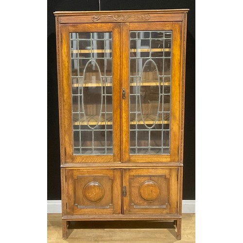 213 - A Jacobean Revival oak bookcase, 181.5cm high, 98cm wide, 32.5cm deep, c.1930