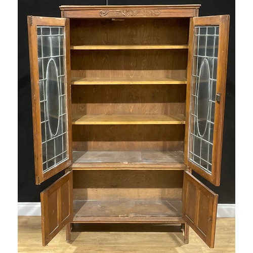 213 - A Jacobean Revival oak bookcase, 181.5cm high, 98cm wide, 32.5cm deep, c.1930