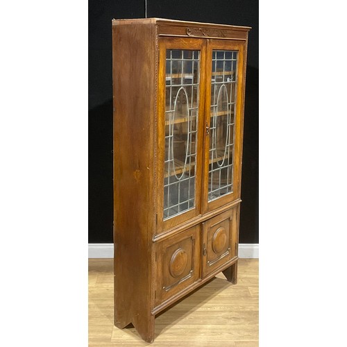 213 - A Jacobean Revival oak bookcase, 181.5cm high, 98cm wide, 32.5cm deep, c.1930