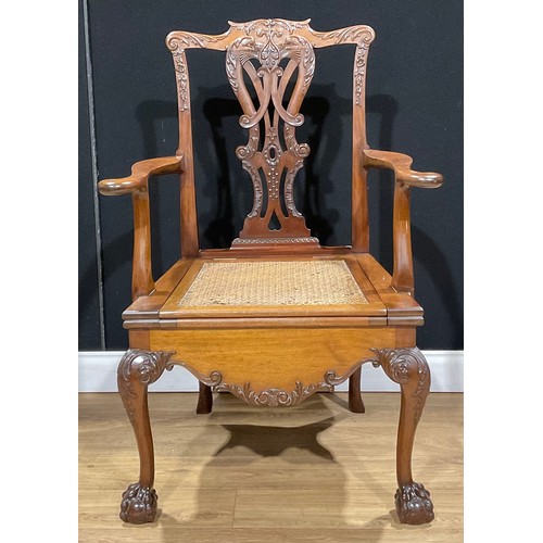 210A - A Chippendale design mahogany commode chair, 108.5cm high, 74cm wide, the seat 54cm wide and 48cm de... 