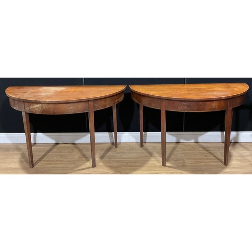 220A - A pair of 19th century mahogany demilune side tables, formerly the end sections of a dining table, e... 