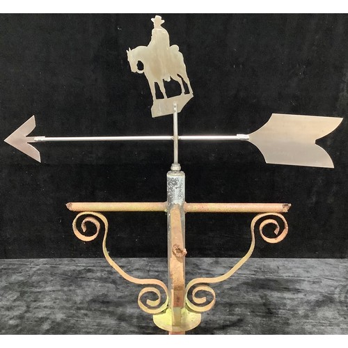 946 - A wrought iron weather vane, steel pointer mounted with copper silhouette of a horseman, 167cm high