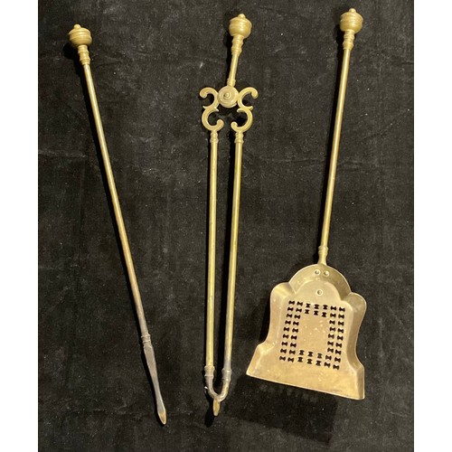 955 - A 19th century three-piece brass fireside companion set