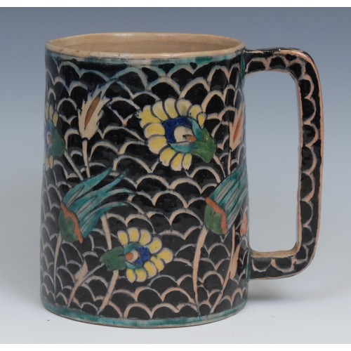 23 - A Middle-Eastern spreading cylindrical mug, painted in the Persian Islamic taste, 14cm high, early 2... 
