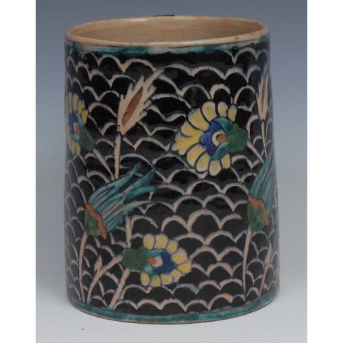 23 - A Middle-Eastern spreading cylindrical mug, painted in the Persian Islamic taste, 14cm high, early 2... 