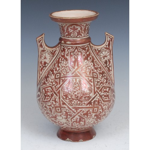 22 - A Middle Eastern lustre vase, decorated in copper lustre in the Islamic taste, 23cm high, 19th centu... 