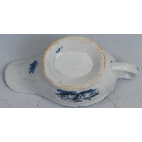 36 - A Lowestoft butter boat, pleat moulded, painted in underglaze blue with landscapes, the interior wit... 