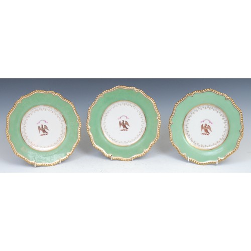 42 - A set of three Flight Barr & Barr shaped circular Armorial plates, centred with eagle crest below ba... 