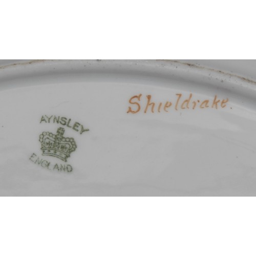 45 - An Aynsley navette shaped dish, painted by F. Mickleright, signed, with a Shieldrake at a lakeside, ... 