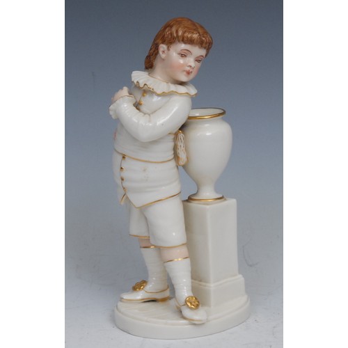 79 - A Royal Worcester figure, of a boy stood next to a vase and pedestal, picked out in flesh tones and ... 